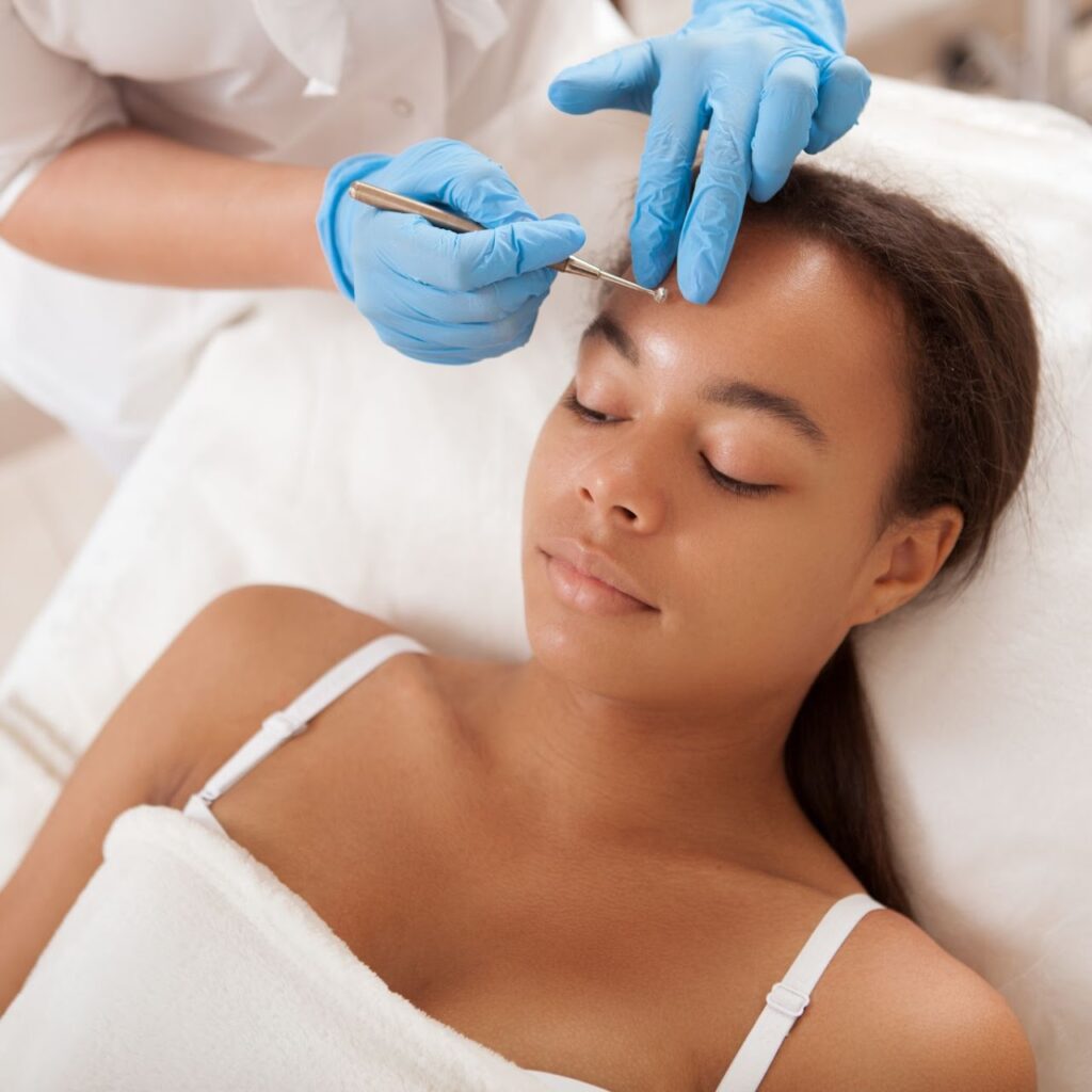 Person receiving facial treatment